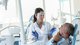 Dentist explaining treatment to patient
