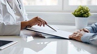 Dental insurance form displayed on large computer monitor