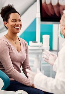 Patient and dentist consulting during a checkup and cleaning