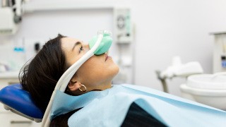 A woman receiving nitrous oxide sedation